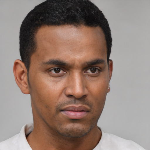 Neutral latino young-adult male with short  black hair and brown eyes