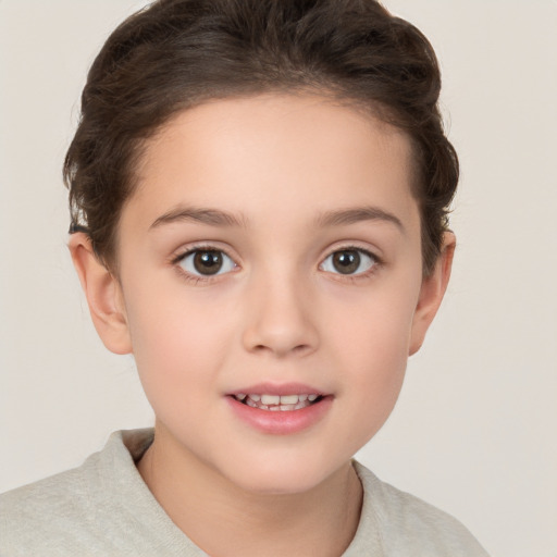 Joyful white child female with short  brown hair and brown eyes