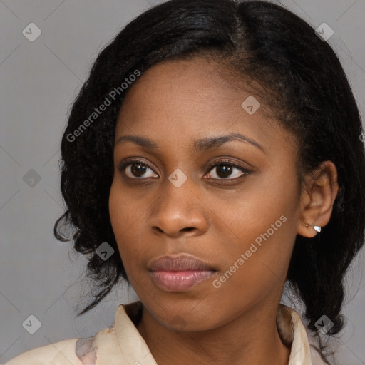 Joyful black young-adult female with medium  black hair and brown eyes