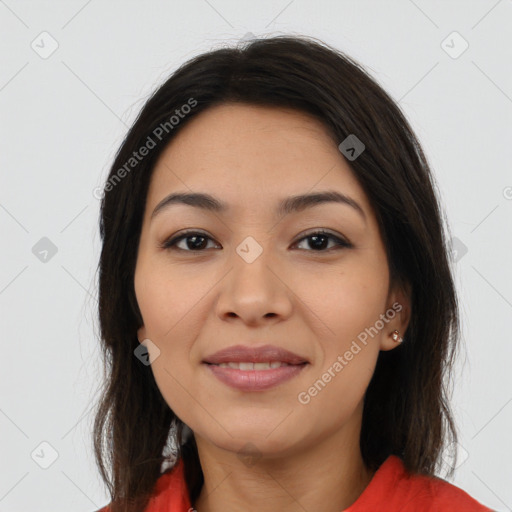 Joyful latino young-adult female with long  brown hair and brown eyes