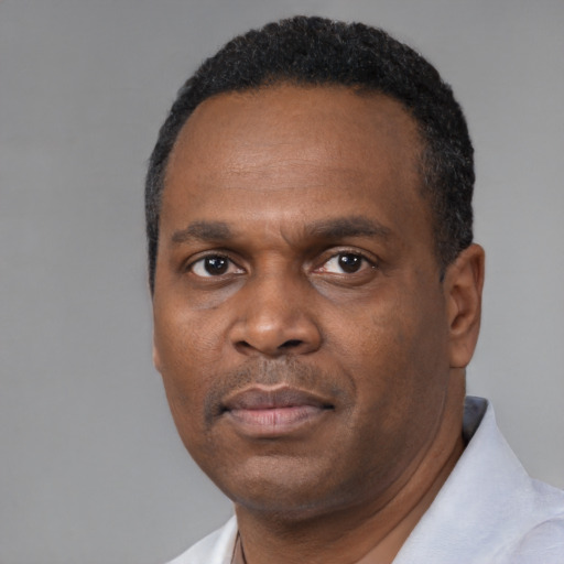 Neutral black adult male with short  black hair and brown eyes