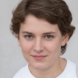 Joyful white young-adult female with medium  brown hair and green eyes