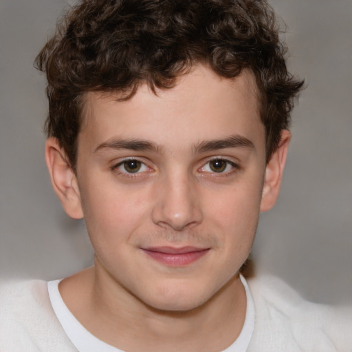 Joyful white child male with short  brown hair and brown eyes