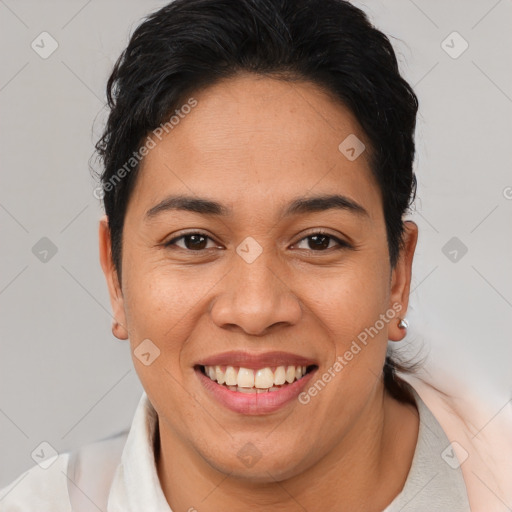 Joyful latino young-adult female with short  brown hair and brown eyes