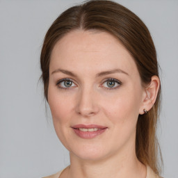 Joyful white young-adult female with medium  brown hair and blue eyes