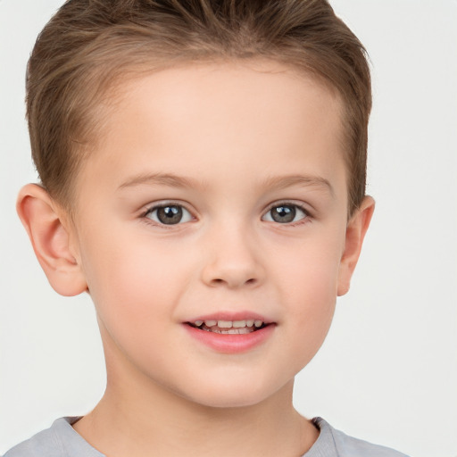 Joyful white child female with short  brown hair and brown eyes