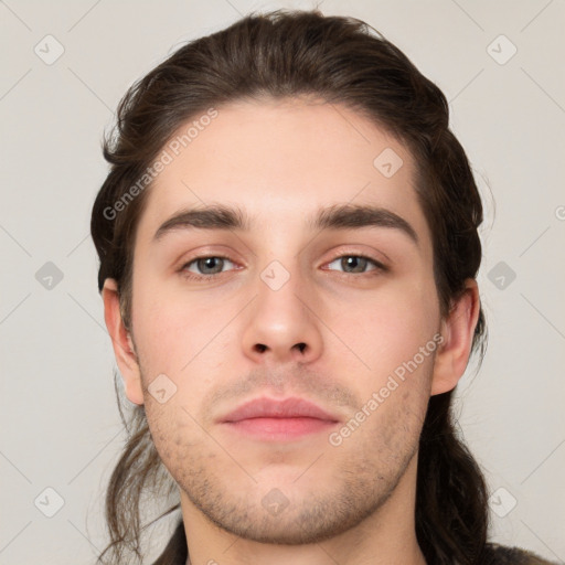 Neutral white young-adult male with short  brown hair and grey eyes