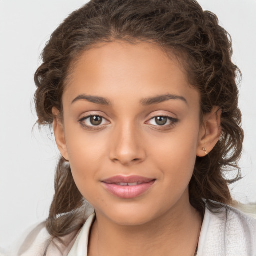 Joyful white child female with medium  brown hair and brown eyes