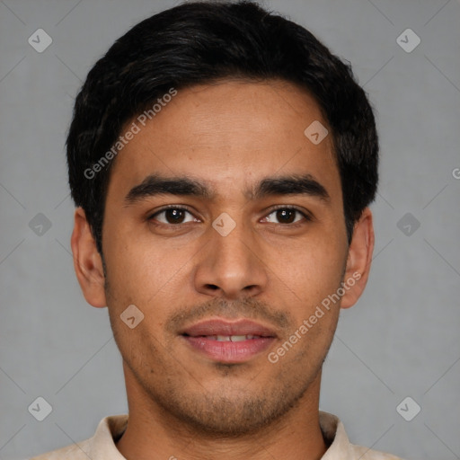 Joyful latino young-adult male with short  black hair and brown eyes