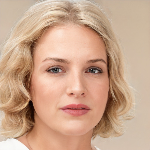 Joyful white young-adult female with medium  blond hair and brown eyes