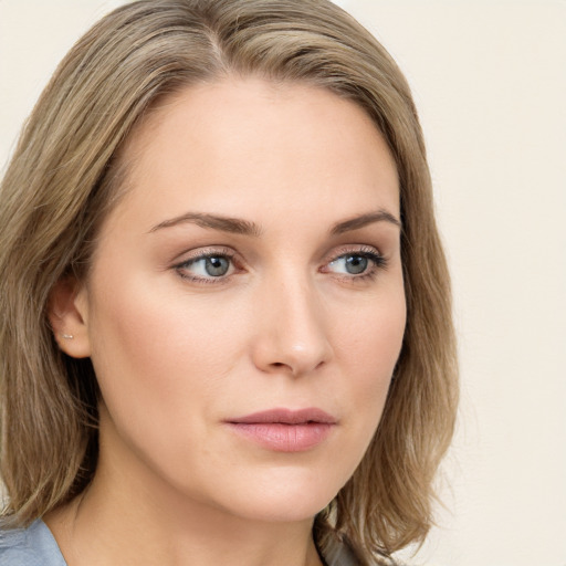 Neutral white young-adult female with long  brown hair and green eyes