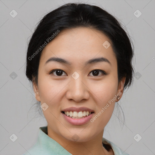 Joyful asian young-adult female with medium  black hair and brown eyes