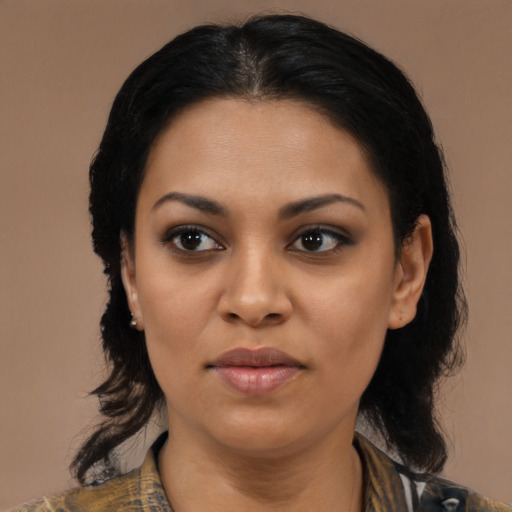 Joyful latino young-adult female with medium  black hair and brown eyes