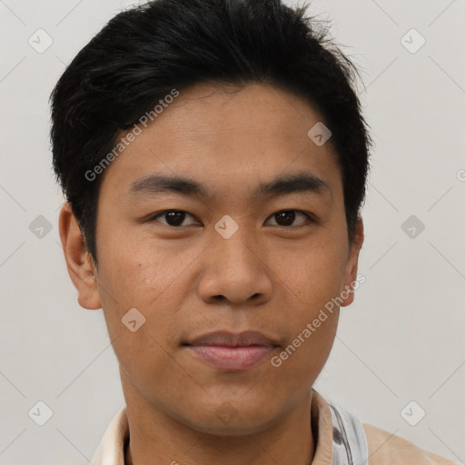 Joyful asian young-adult male with short  brown hair and brown eyes