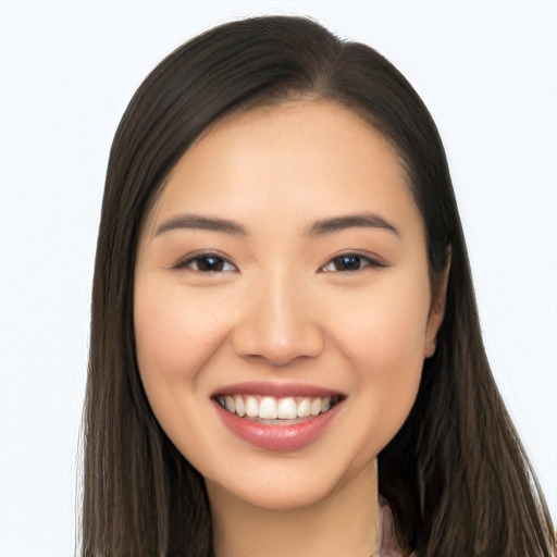 Joyful asian young-adult female with long  brown hair and brown eyes