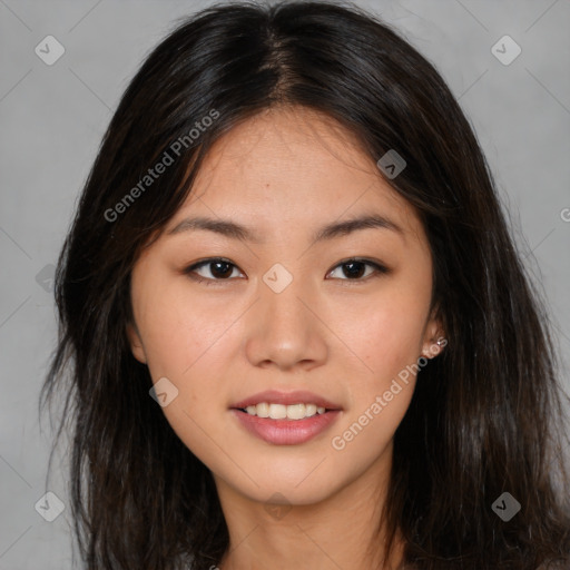 Joyful asian young-adult female with long  brown hair and brown eyes