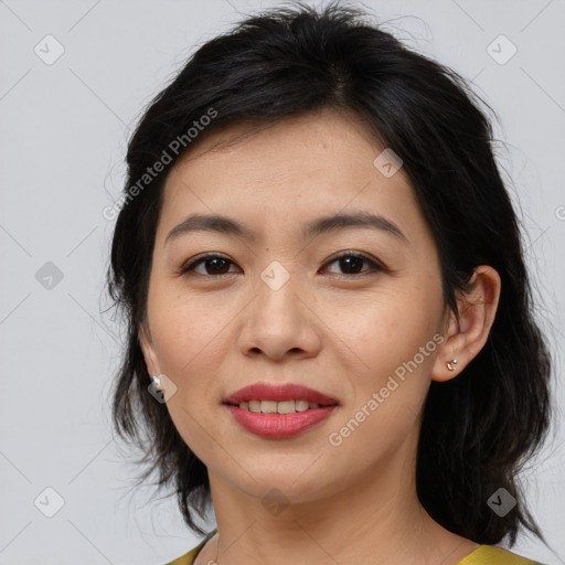 Joyful asian young-adult female with medium  brown hair and brown eyes