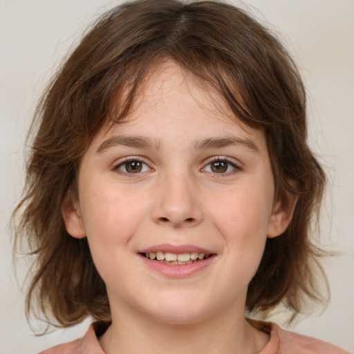 Joyful white child female with medium  brown hair and brown eyes