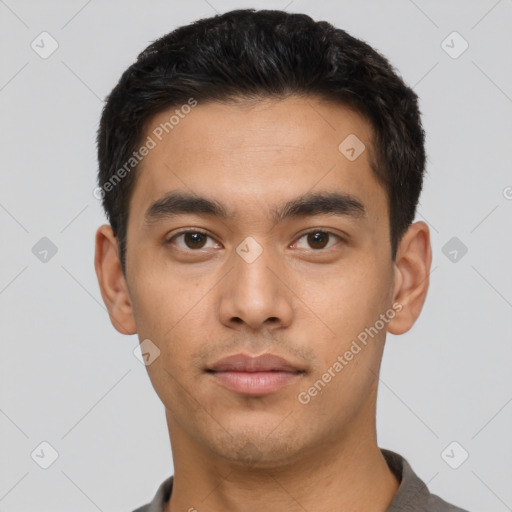 Neutral latino young-adult male with short  black hair and brown eyes