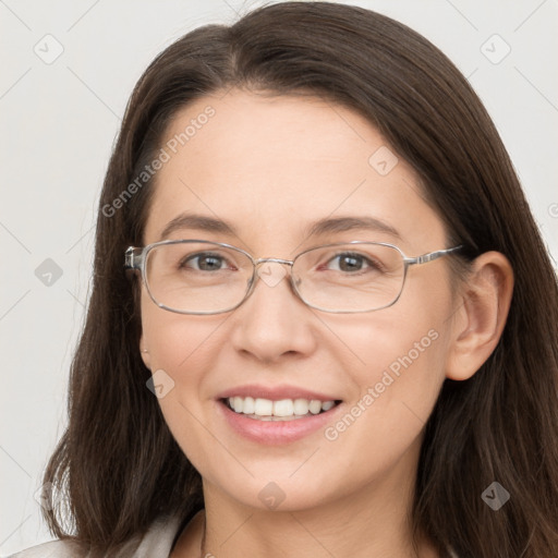 Joyful white adult female with long  brown hair and brown eyes