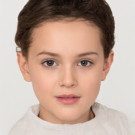 Joyful white child female with short  brown hair and brown eyes