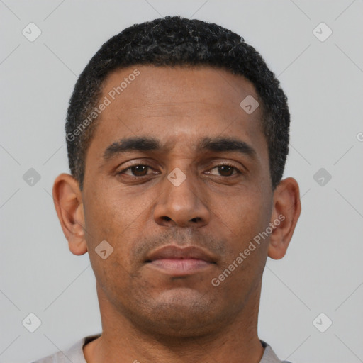 Neutral latino young-adult male with short  black hair and brown eyes