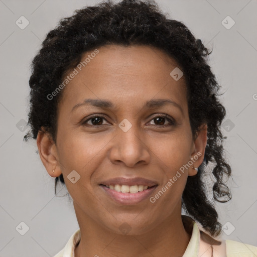 Joyful black adult female with short  brown hair and brown eyes