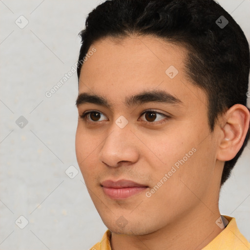 Joyful white young-adult male with short  black hair and brown eyes