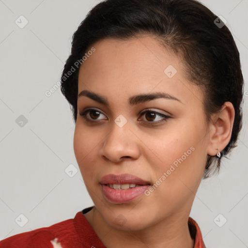 Joyful latino young-adult female with medium  brown hair and brown eyes