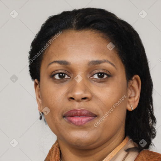 Joyful latino adult female with short  brown hair and brown eyes