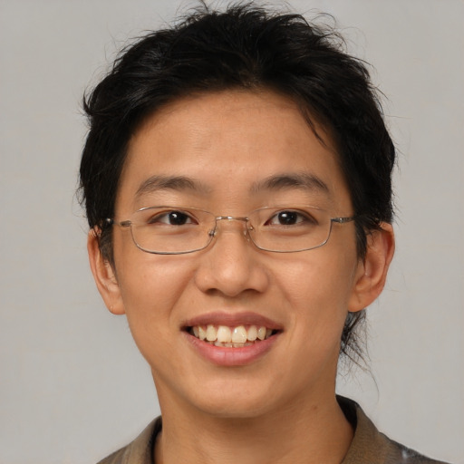 Joyful asian adult female with short  brown hair and brown eyes