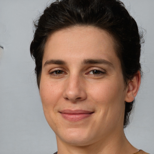 Joyful white young-adult female with medium  brown hair and brown eyes