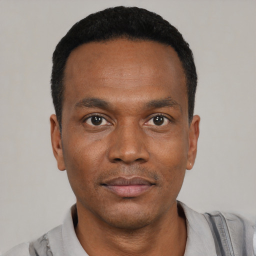 Neutral black young-adult male with short  black hair and brown eyes