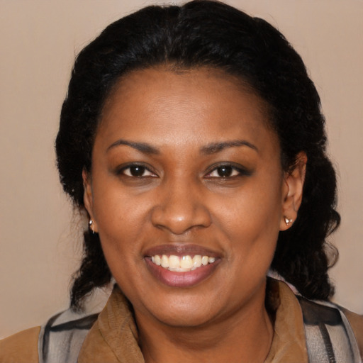 Joyful black young-adult female with medium  black hair and brown eyes