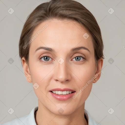 Joyful white young-adult female with short  brown hair and grey eyes