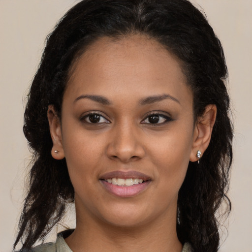 Joyful black young-adult female with medium  brown hair and brown eyes