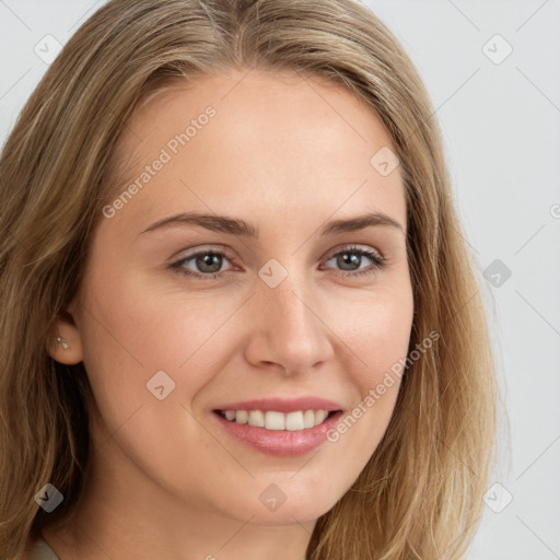 Joyful white young-adult female with long  brown hair and brown eyes