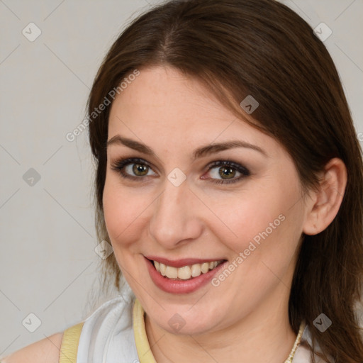 Joyful white young-adult female with medium  brown hair and brown eyes