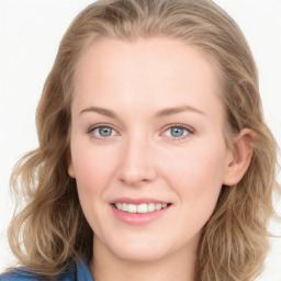 Joyful white young-adult female with long  brown hair and blue eyes