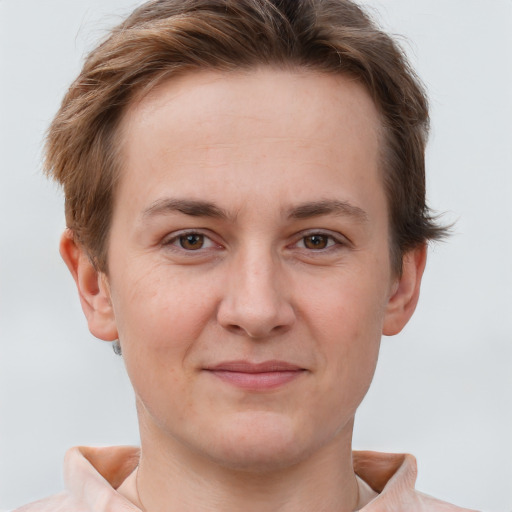 Joyful white young-adult female with short  brown hair and grey eyes