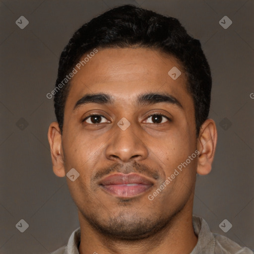 Joyful latino young-adult male with short  brown hair and brown eyes