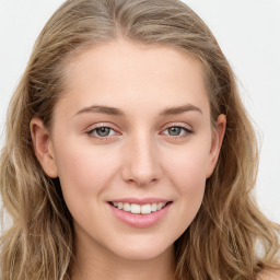 Joyful white young-adult female with long  brown hair and blue eyes