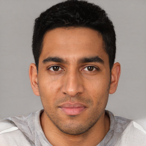 Neutral latino young-adult male with short  black hair and brown eyes