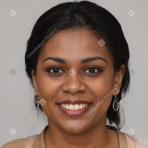 Joyful black young-adult female with long  brown hair and brown eyes