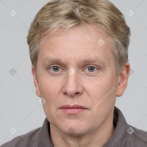 Neutral white adult male with short  brown hair and grey eyes