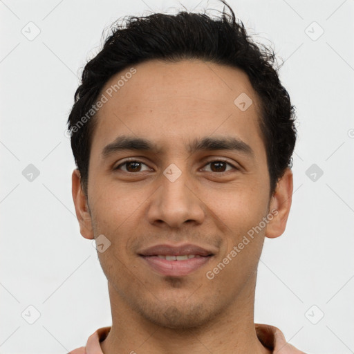 Joyful latino young-adult male with short  black hair and brown eyes