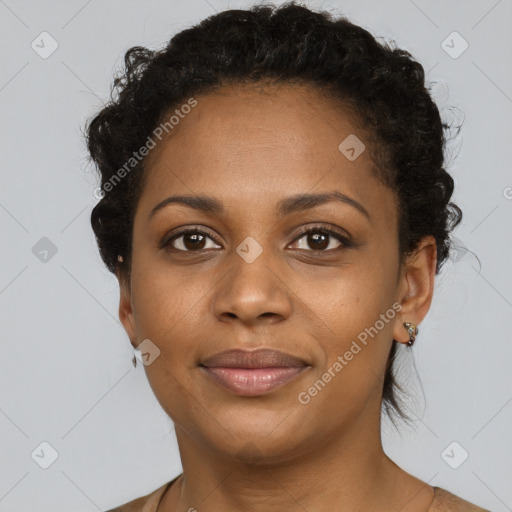 Joyful black adult female with short  brown hair and brown eyes