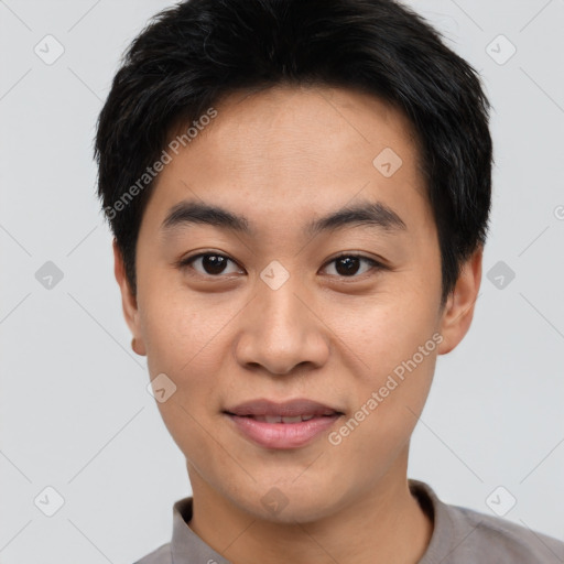 Joyful asian young-adult male with short  black hair and brown eyes