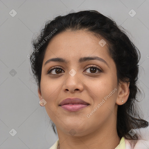 Joyful latino young-adult female with medium  brown hair and brown eyes