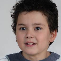 Joyful white child male with short  brown hair and brown eyes